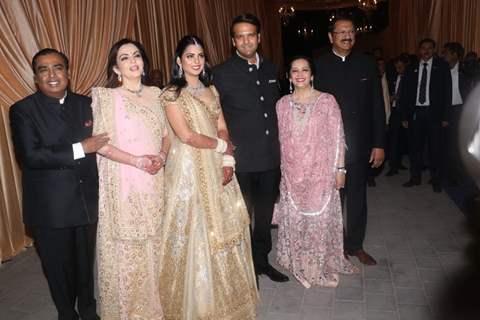The Ambani Family poses for shutterbugs at Isha Ambani and Anand Piramal Wedding Reception