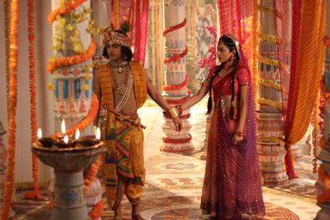 Radha holding hand of Krishna from RadhaKrishn