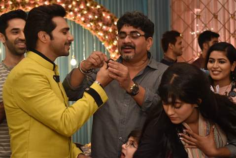 Samir Onkar giving cake to Rajan Shahi