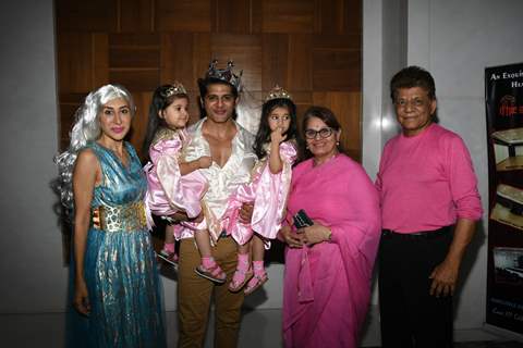 Karanvir Bohra and Teejay Sidhu with their twin daughters, Bella and Vienna