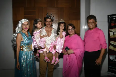 Karanvir Bohra and Teejay Sidhu with their twin daughters, Bella and Vienna