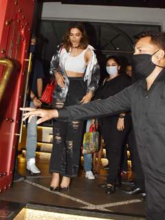 Deepika Padukone mobbed by fans; looks troubled as a women tries to pull her red bag