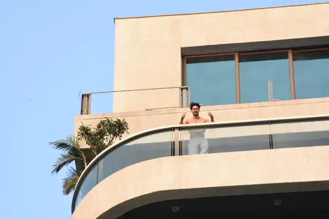 Tiger Shroff snapped flexing muscles in his balcony