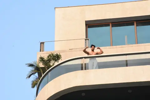 Tiger Shroff snapped flexing muscles in his balcony