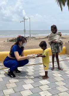 Urvashi Rautela distributes food amongst the needy affected by the cyclone Tauktae