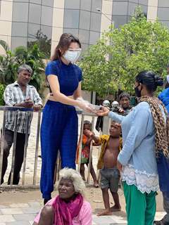 Urvashi Rautela distributes food amongst the needy affected by the cyclone Tauktae