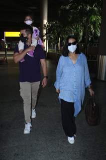 Neha Dhupia and Angad Bedi snapped arriving at Mumbai airport on Monday