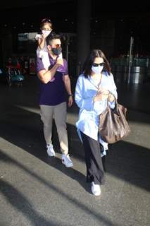 Neha Dhupia and Angad Bedi snapped arriving at Mumbai airport on Monday