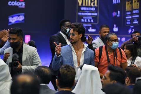 Tiger Shroff poses to paparazzi at IIFA awards press conference in Abu Dhabi