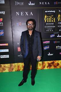 Anees Bazmee poses on the green carpet of IIFA awards 2022