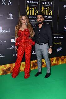 Rakhi Sawant poses with her boyfriend Adil Khan on the green carpet of IIFA awards 2022 Durrani