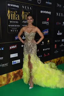 Kriti Sanon poses to paparazzi at green carpet of IIFA awards 2022 in Abu Dhabi