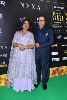 Ramesh Taurani and his wife poses to paparazzi at green carpet of IIFA awards 2022 in Abu Dhabi