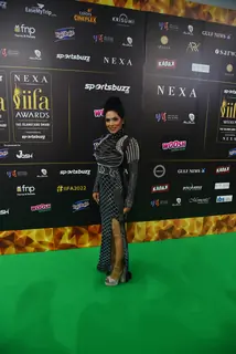 Celebrity poses to paparazzi at green carpet of IIFA awards 2022 in Abu Dhabi