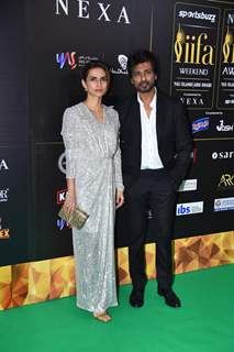 Nikhil Dwivedi and his wife Gaurie poses to paparazzi at green carpet of IIFA awards 2022 in Abu Dhabi