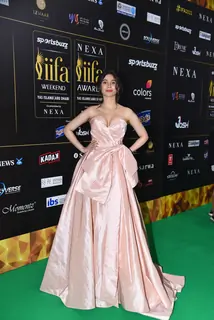 Celebrity poses to paparazzi at green carpet of IIFA awards 2022 in Abu Dhabi
