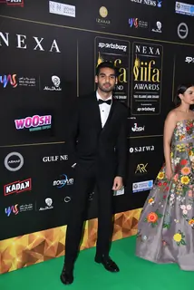 Ahan Shetty poses to paparazzi at green carpet of IIFA awards 2022 in Abu Dhabi