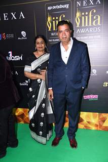 Sham Kaushal and Veena Kaushal poses to paparazzi at green carpet of IIFA awards 2022 in Abu Dhabi