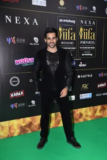 Celebrity poses to paparazzi at green carpet of IIFA awards 2022 in Abu Dhabi