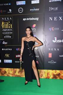 Nora Fatehi poses to paparazzi at green carpet of IIFA awards 2022 in Abu Dhabi