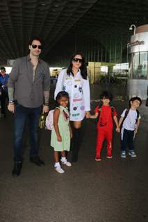 Sunny Leone poses with husband Daniel Weber and her kids at the Mumbai airport 