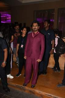 Nawazuddin Siddiqui poses to paparazzi at an award function