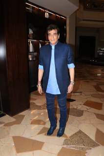 Jeetendra poses to paparazzi at an award function