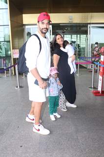 Neha Dhupia and Angad Bedi spotted with kids at the Mumbai airport