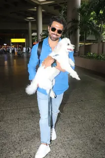Rithvik Dhanjani snapped with his pet at the Mumbai airport 