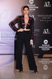 Elnaaz Norouzi grace the red carpet of Manish Malhotra’s Mijwan Couture show in a shimmery criss cross crop top and flared pants