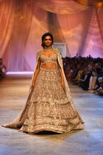 Deepika Padukone looked like a million bucks as she walked the ramp for Manish Malhotra in an ivory, embroidered lehenga