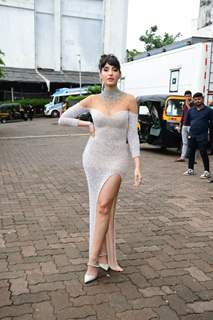 Nora Fatehi looked sizzling hot in a shimmery thigh high slit gown