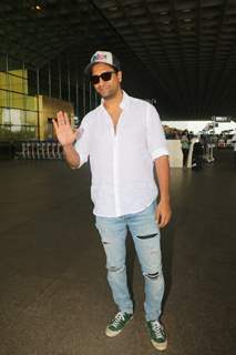 Vicky Kaushal kept his airport look cool and casual in a crisp white shirt, denims and a cap