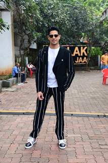 Sidharth Malhotra looked handsome in a  black and white striped pant suit