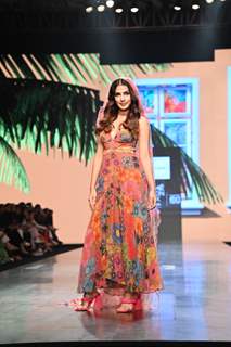 Rhea Chakraborty stunned the ramp at the Lakme Fashion Week in a floral gown with a plunging neckline