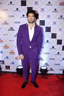 Karan Karan Kundrra looked dapper in a purple suit and trousers as he attended an award show in the city 