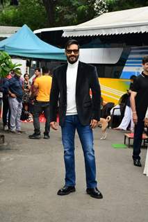 Ajay Devgn promotes Thank God in a velvet suit and white turtle neck t-shirt and denims