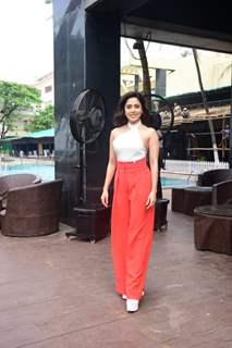 Nushrat Bharucha is a fashion diva in a white halter neck top and red wide legged pants
