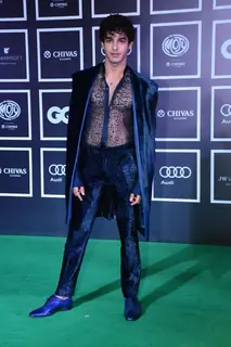 Ishaan Khatter made a stunning appearance in a blue velvet suit with a see-through shirt and matching shoes.