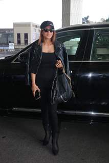 Nia Sharma sports an all black look at the airport in a leather jacket, black top, pants and boots