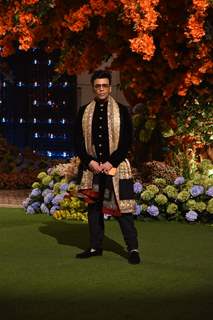 Karan Johar wore a black kurta set paired with a golden shawl. 