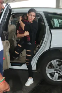 Nayanthara snapped with her child at the Mumbai airport