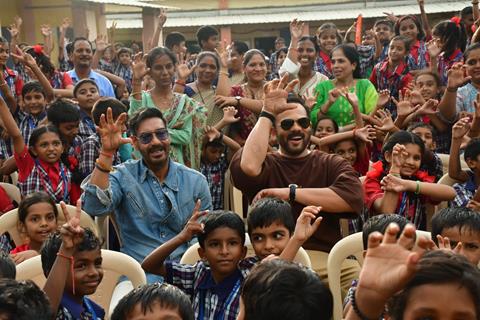 Ajay Devgn and Rohit Shetty attempt the Guinness World Record for the largest Vada Pav delivery at Airport High School & Junior College