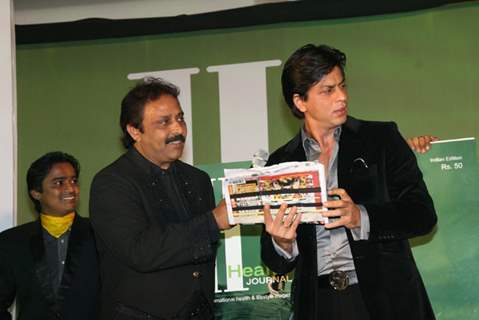 Shah Rukh Khan with Thumbey Moideen at the launch of a health magazine &quot;Health International&quot; in Mumbai on April8