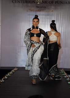 Models show Shobhaa De sarees for Samsaara