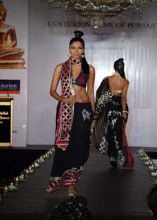 Models show Shobhaa De sarees for Samsaara