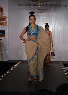 Models show Shobhaa De sarees for Samsaara