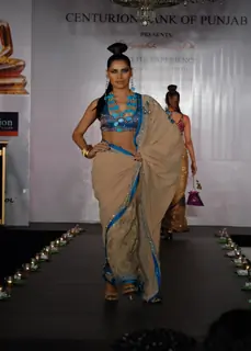 Models show Shobhaa De sarees for Samsaara