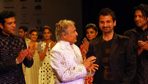 Ustad Amjad Ali Khan and his son Aman Ali Bangash and Ayan Ali Bangas showcases a design by Zubzir Kirmani on the catwalk during the Kolkata Fashion Week in Kolkata on 9th Sept 2009