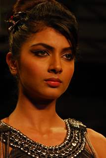 A model showcases a design by Leena Taneja on the catwalk during the Kolkata Fashion Week in Kolkata on 9th Sep 2009